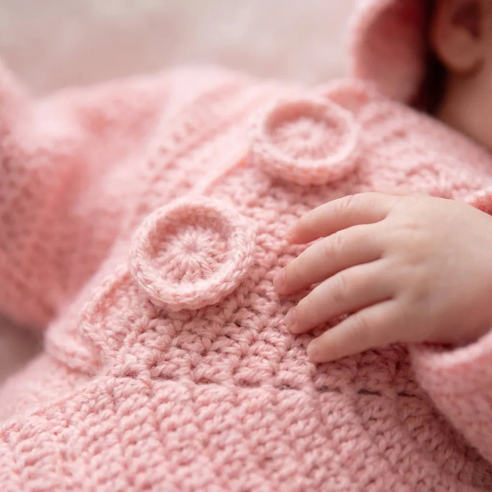 Close-up of the soft crochet texture and buttons
